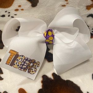 White 6 inch bow with “Tigers” purple and gold logo.